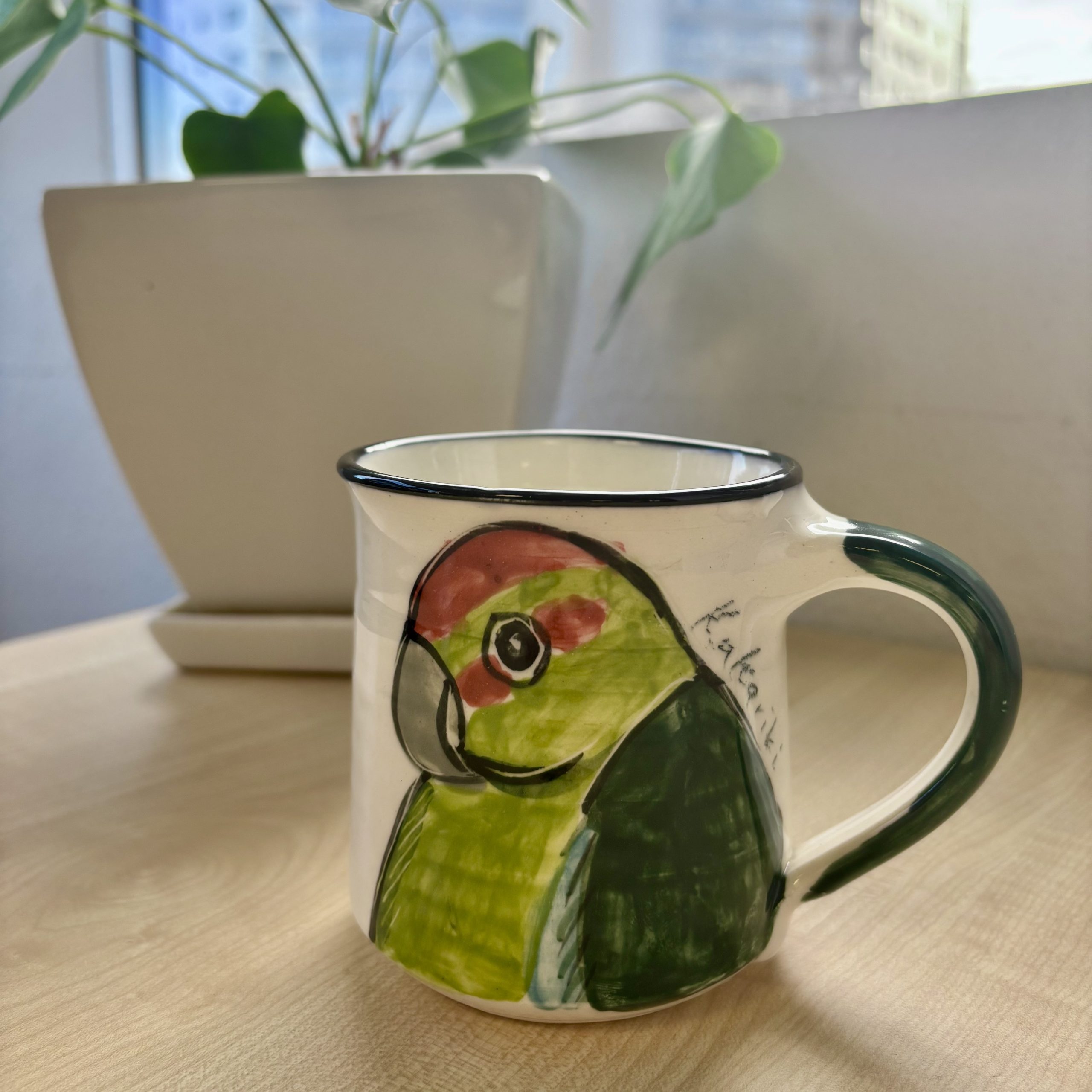 mug depicting kakariki bird
