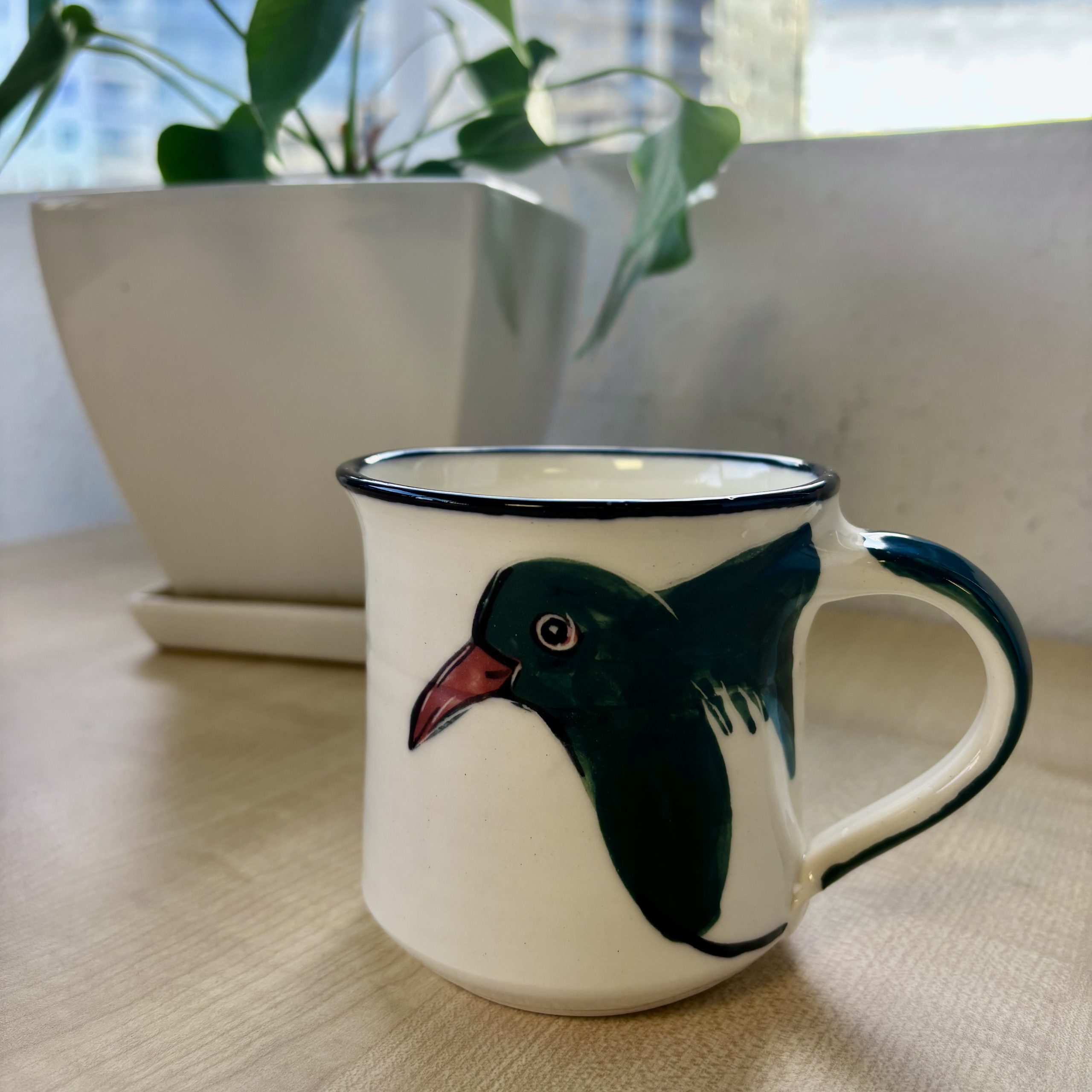 mug depicting kereru bird