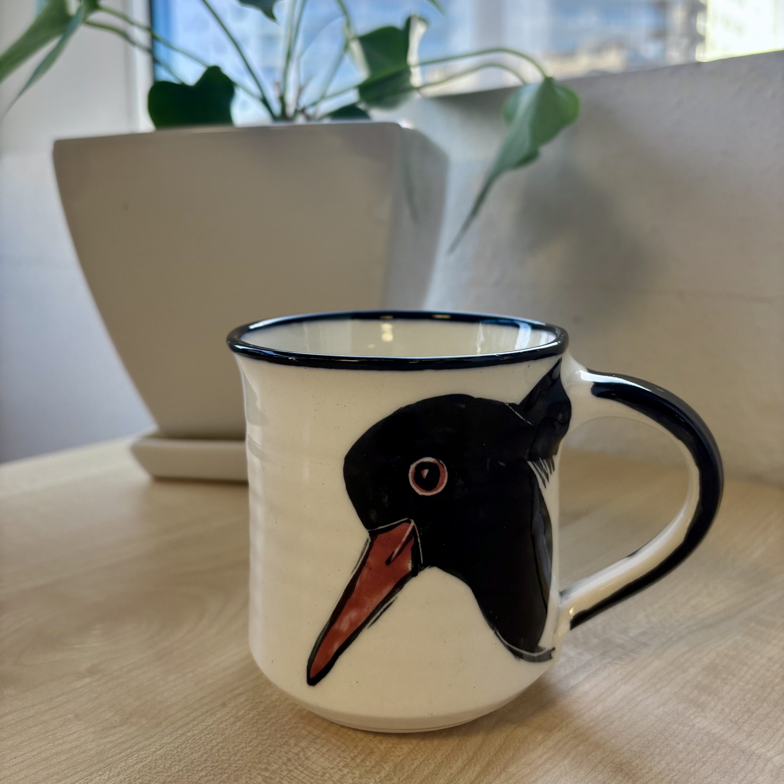 mug depicting torea bird
