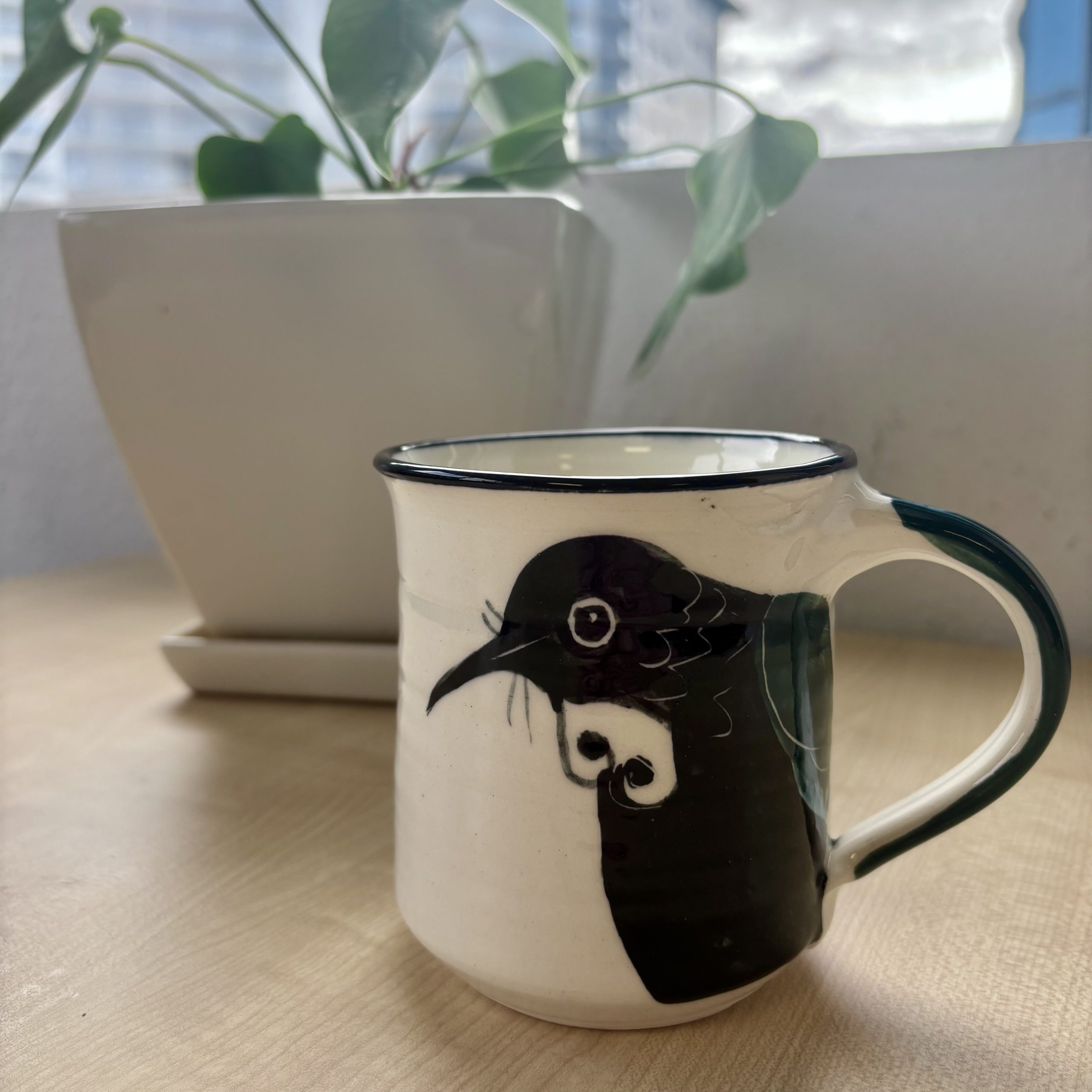 mug depicting tui bird