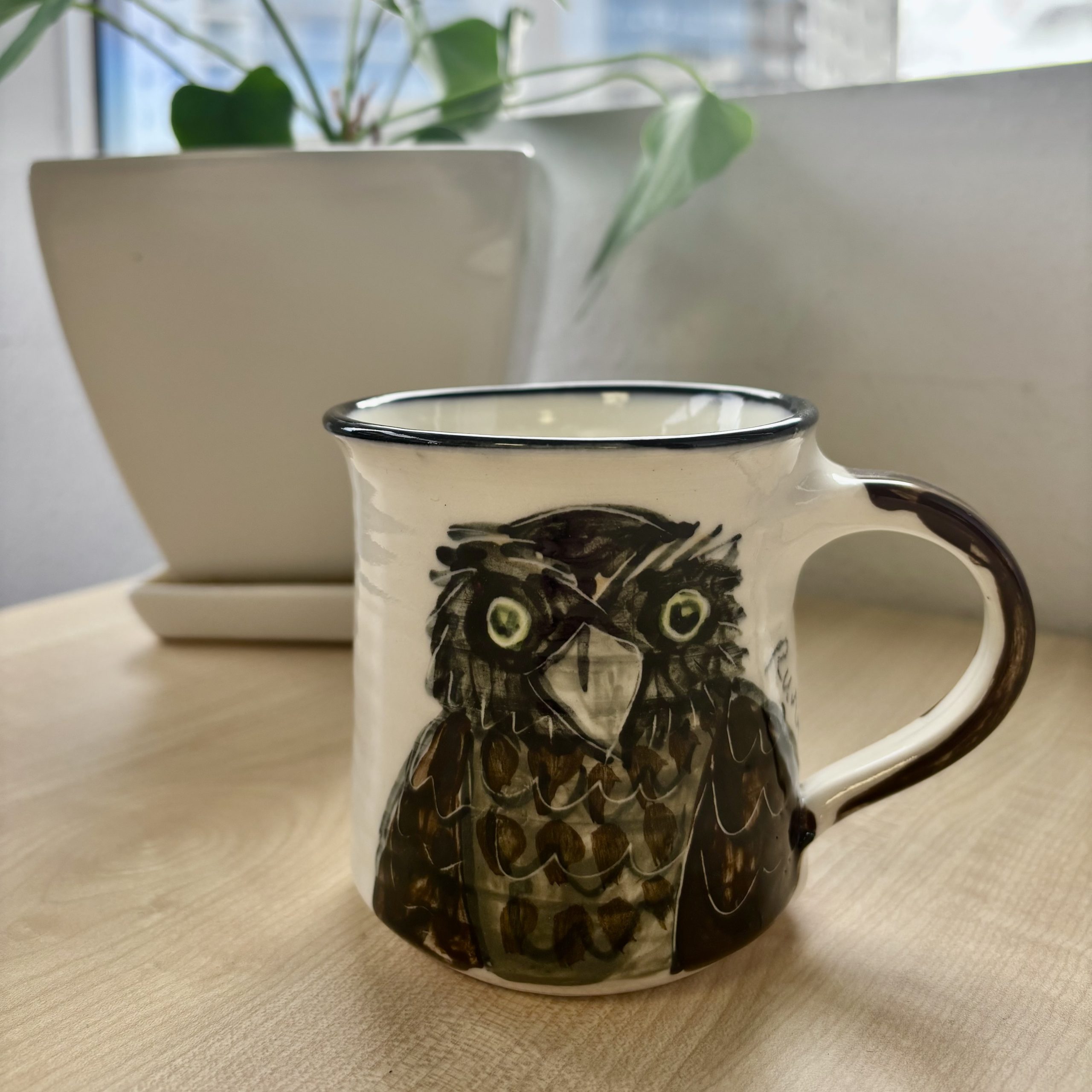 mug depicting ruru bird