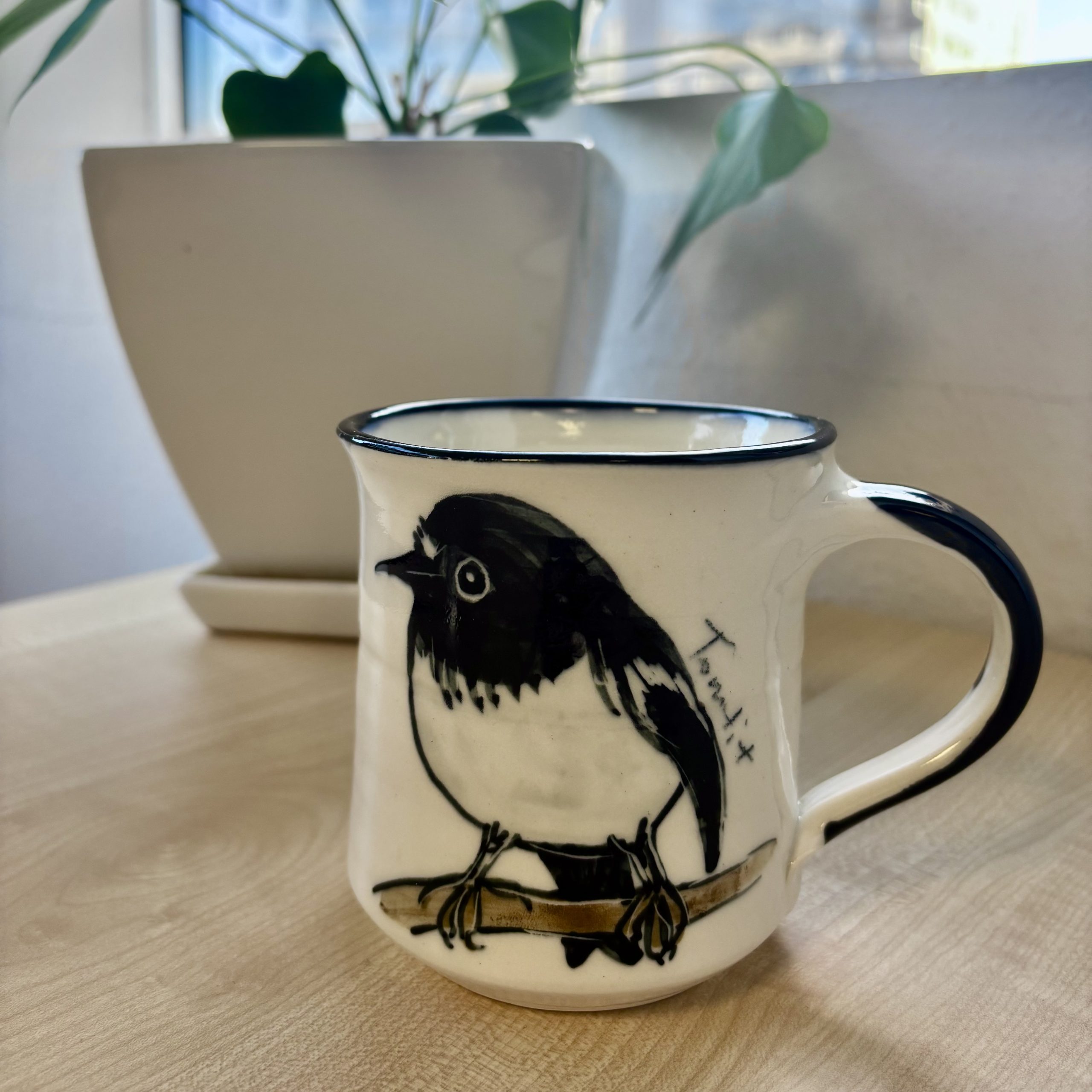mug depicting miromiro bird